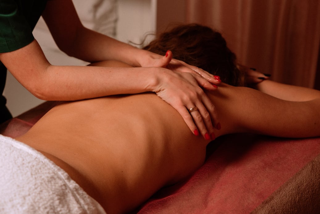 Masseur Giving Woman Back Massage